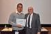 Dr. Nagib Callaos, General Chair, giving Ing. Miguel A. Luna Pérez the best paper award certificate of the session "Aplicaciones de Informática y Cibernética en Ciencia e Ingeniería." The title of the awarded paper is "Metodología de Mantenimiento Predictivo 4.0 para Asegurar Procesos de Producción."